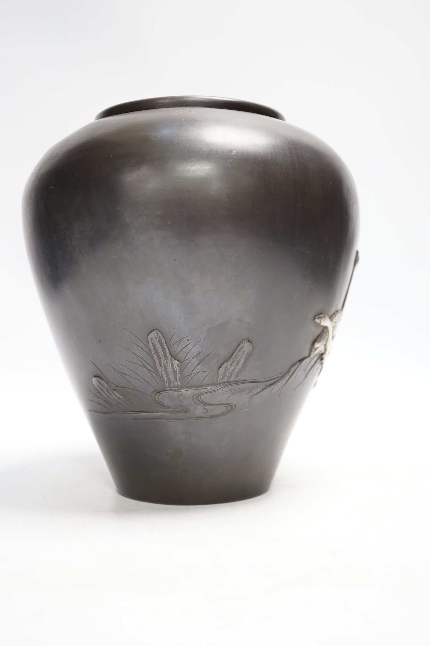 A Japanese white metal overlaid bronze vase, Meiji period, 21cm